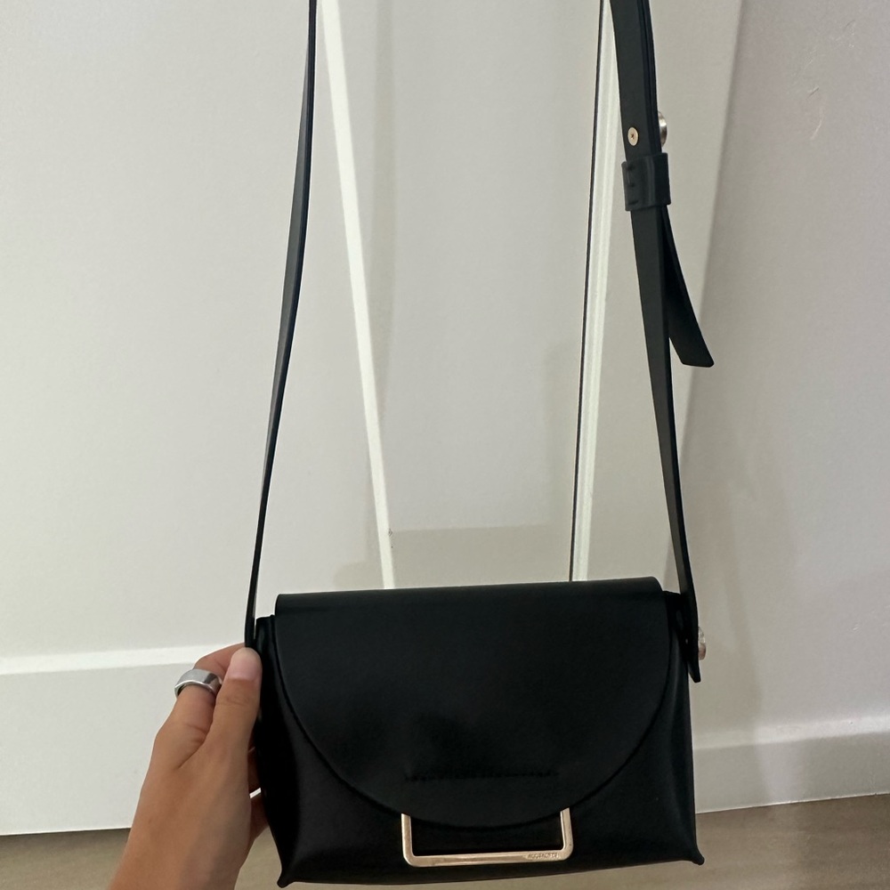 All Saints Black Leather Crossbody Bag with Gold Accent